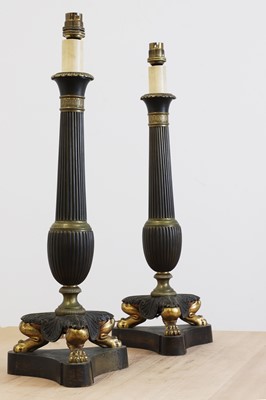 Lot 673 - A pair of Empire-style gilt and patinated bronze table lamps