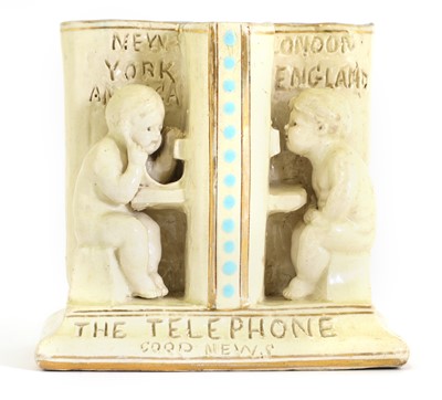 Lot 59 - A Doulton stoneware spill vase, 'The Telephone/Good News'