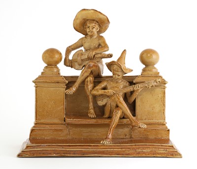 Lot 72 - A Doulton stoneware double 'Merry Musician' group