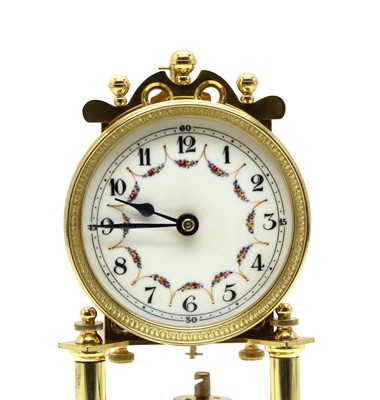 Lot 209 - A brass torsion clock