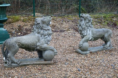 Lot 411 - A pair of reconstituted stone garden statues