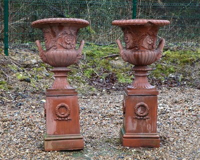 Lot 413 - A pair of large faux terracotta garden urns on stands