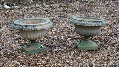 Lot 417 - A pair of reconstituted stone garden urns