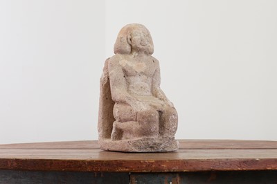 Lot 305 - A carved limestone figure of a kneeling scribe