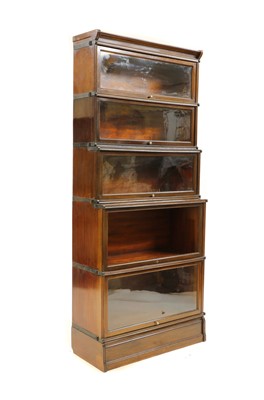 Lot 489 - A five section walnut modular bookcase