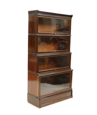 Lot 488 - A four section walnut modular bookcase