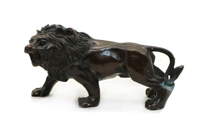 Lot 296 - A bronze study of a lion