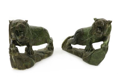 Lot 100 - A pair of floor standing Chinese soapstone lions