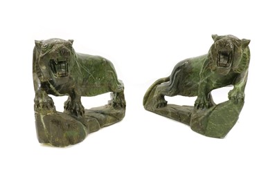 Lot 100 - A pair of floor standing Chinese soapstone lions