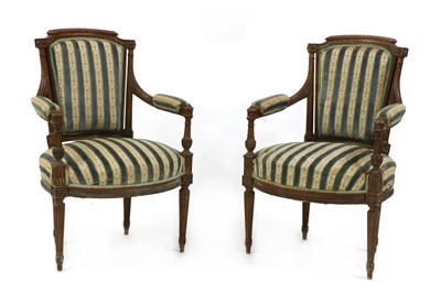 Lot 493 - A pair of walnut and parcel-gilt elbow chairs