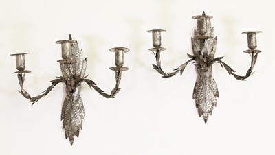 Lot 109 - A pair of Iberian tinned toleware three-candle wall lights