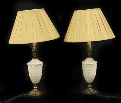 Lot 202 - A pair of white porcelain table lamps