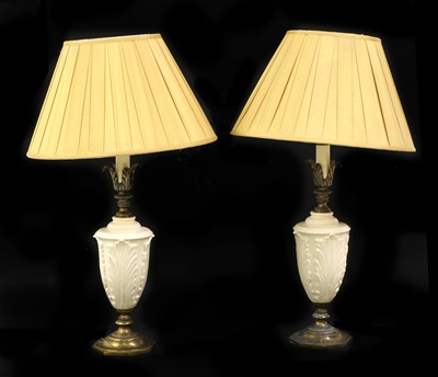 Lot 202 - A pair of white porcelain table lamps