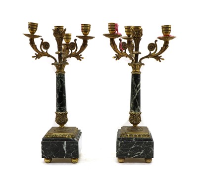 Lot 305 - A pair of brass and marble three branch candelabra