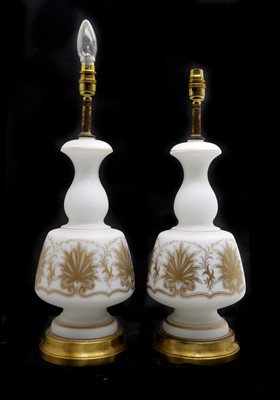 Lot 316 - A pair of white opaline glass table lamps