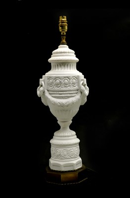 Lot 203 - A pair of white bisque porcelain table lamps