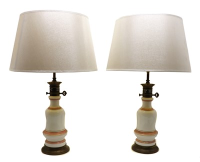 Lot 206 - A pair of white opaline glass table lamps