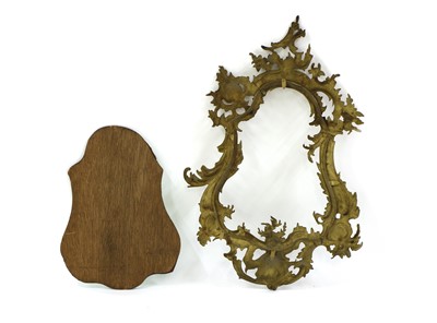 Lot 272 - A brass Rococo-style mirror