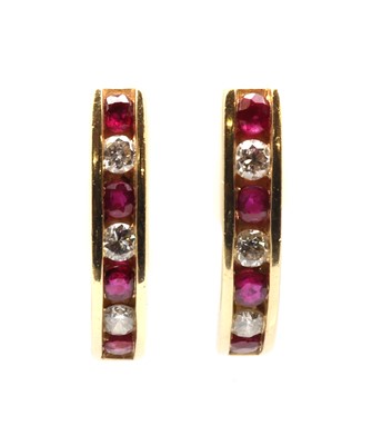 Lot 113 - A pair of 9ct gold ruby and diamond 'J' hoop earrings