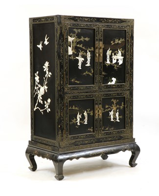 Lot 349 - A Japanese black lacquered cabinet