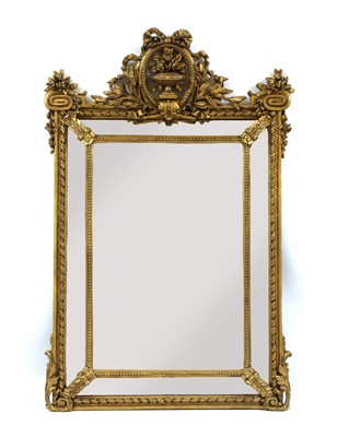 Lot 366 - A giltwood cushion wall mirror