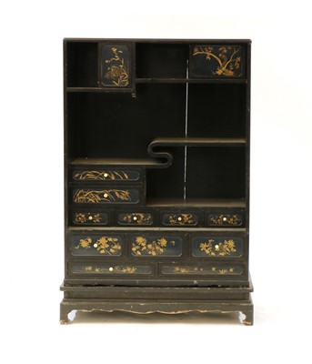 Lot 379 - A Japanese black lacquered cabinet