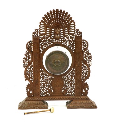 Lot 368 - A Burmese carved teak gong and stand