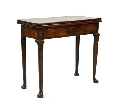 Lot 518 - A George II mahogany tea table