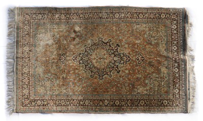 Lot 396 - A Persian silk rug
