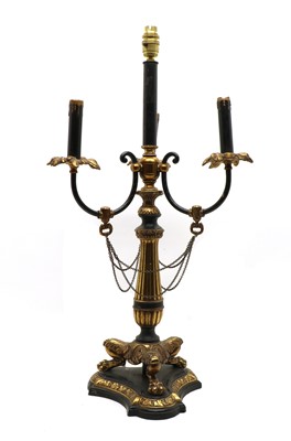 Lot 325 - A gilt brass and part ebonised table lamp