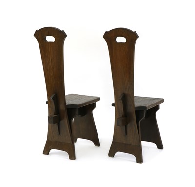 Lot 12 - A pair of American Arts and Crafts oak hall chairs
