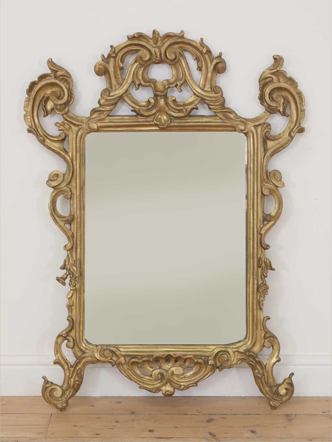 Lot 126 - A baroque carved giltwood wall mirror
