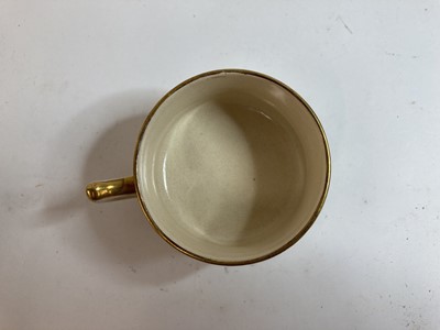 Lot 77 - A set of three Japanese Satsuma ware tea cups and saucers