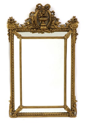 Lot 409A - A giltwood cushion wall mirror