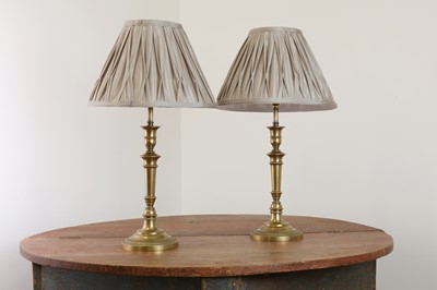 Lot 441 - A pair of French Empire-style brass table lamps