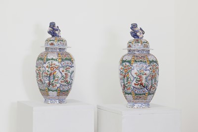 Lot 205 - A pair of Dutch delft vases and covers