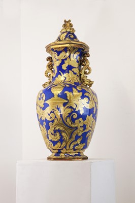 Lot 501 - A large ironstone pottery vase and cover
