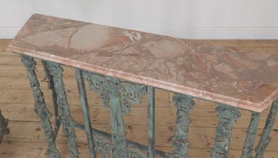 Lot 460 - A pair of marble-topped cast iron console tables