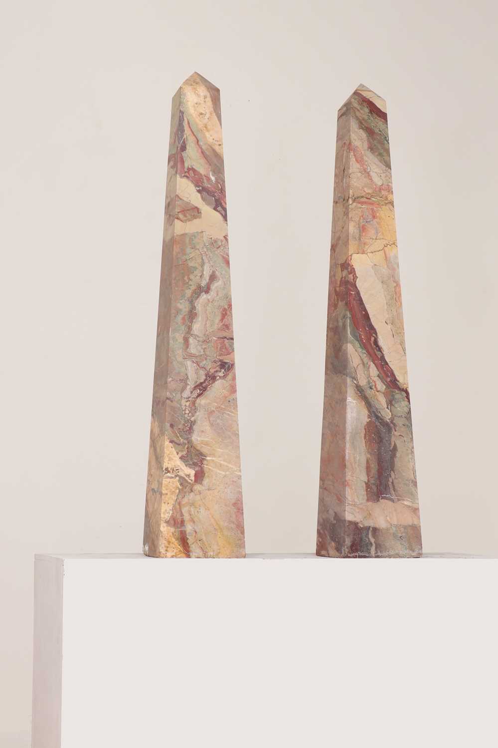 Lot 415 - A pair of large pink marble obelisks