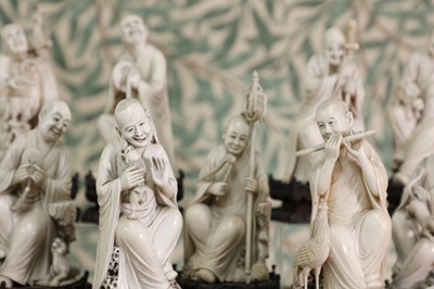 Lot 423 - A set of eighteen carved ivory figures