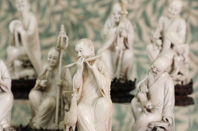 Lot 423 - A set of eighteen carved ivory figures