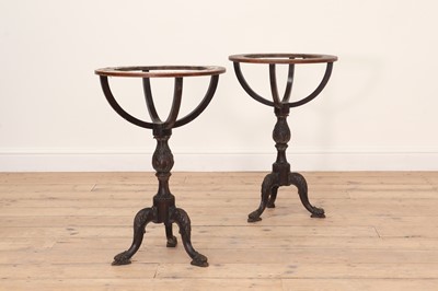 Lot 478 - A pair of George III mahogany globe stands