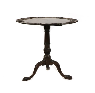 Lot 481 - A mahogany and carved tilt top table