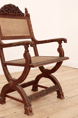 Lot 96 - A carved sandalwood elbow chair