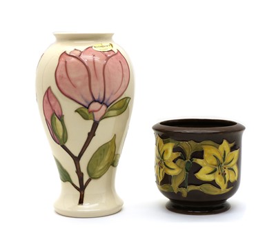 Lot 200A - A Moorcroft pottery ‘Magnolia’ pattern vase