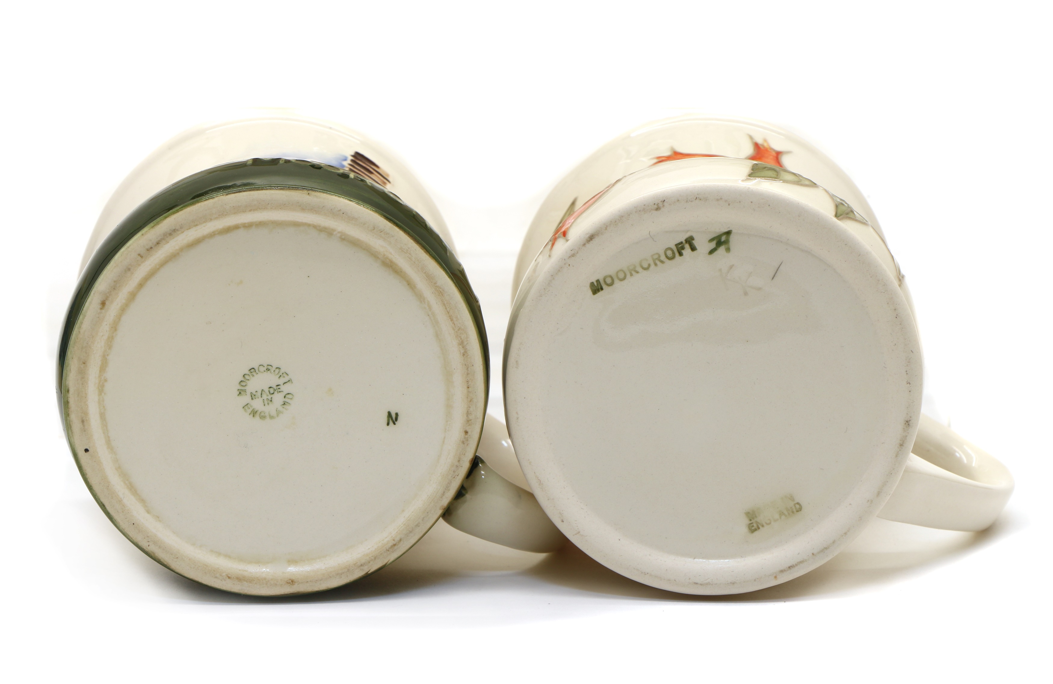 Lot 91 A collection of Moorcroft pottery mugs,