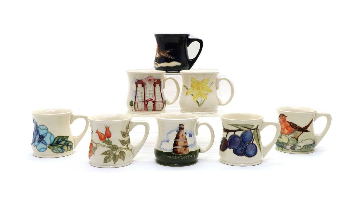 Lot 91 - A collection of Moorcroft pottery mugs
