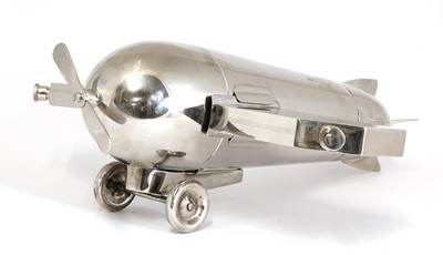 Lot 153 - A novelty silver-plated 'monoplane' travelling bar cocktail set