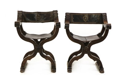 Lot 376 - A pair of walnut Savonarola style X frame elbow chairs