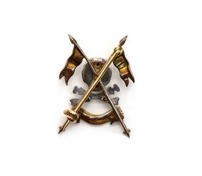 Lot 64 - A Royal Lancers 9ct gold and enamel sweetheart brooch